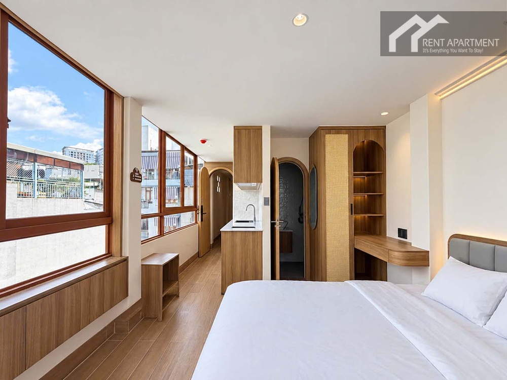 ID 2263 studio apartment overview with comfortable bed and bright window wall